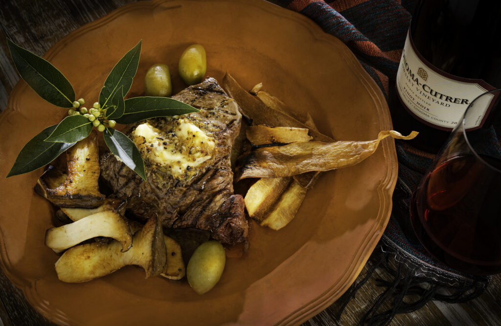 Grilled Sirloin Steaks with Green Olive Butter