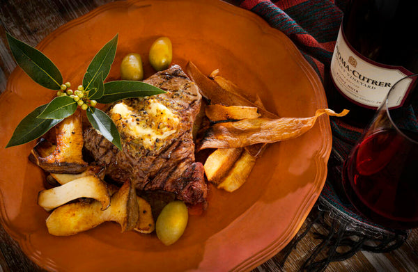 Grilled Sirloin Steaks with Green Olive Butter
