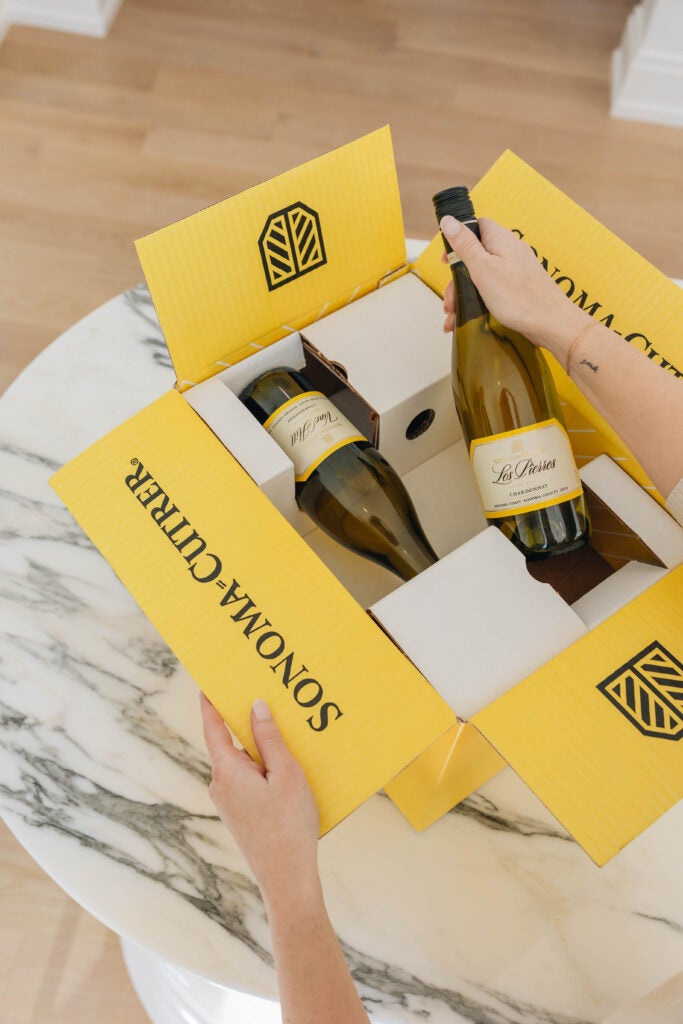 Wine club member unboxing their shipment